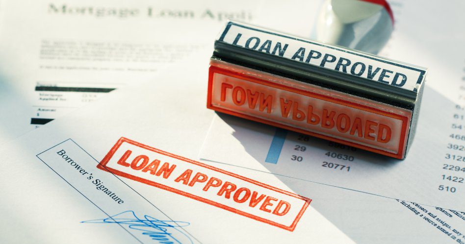 “LOAN APPROVED” Approval Red Rubber Stamp Approving Mortgage Application Document