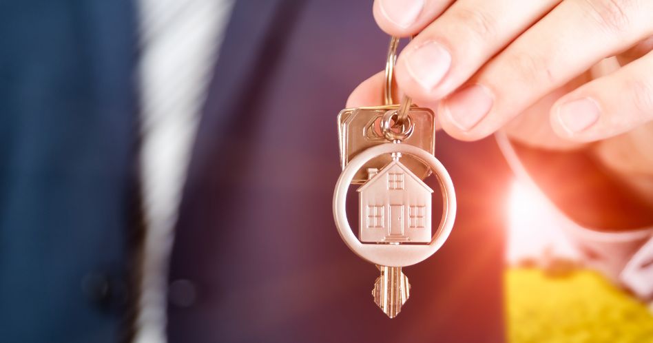 real estate agent holding key