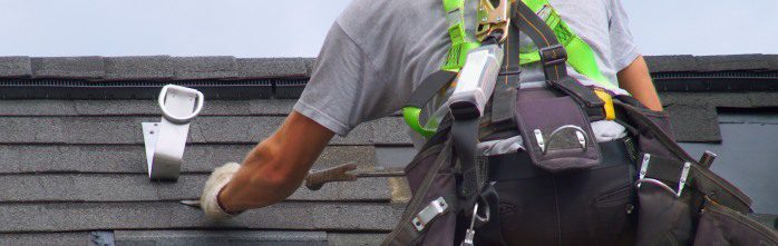 roof repair construction worker roofer man roofing security rope